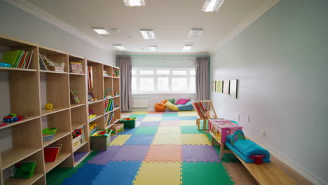 bright and colorful playroom with bookshelves and reading nook