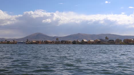 travelling by ship from puno to the uros islands on lake titicaca, peru, south america