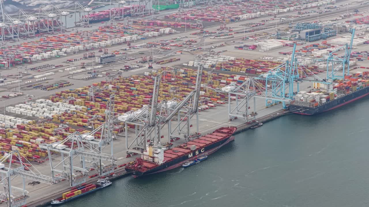 Aerial cargo ships at container port transporting goods, Netherlands