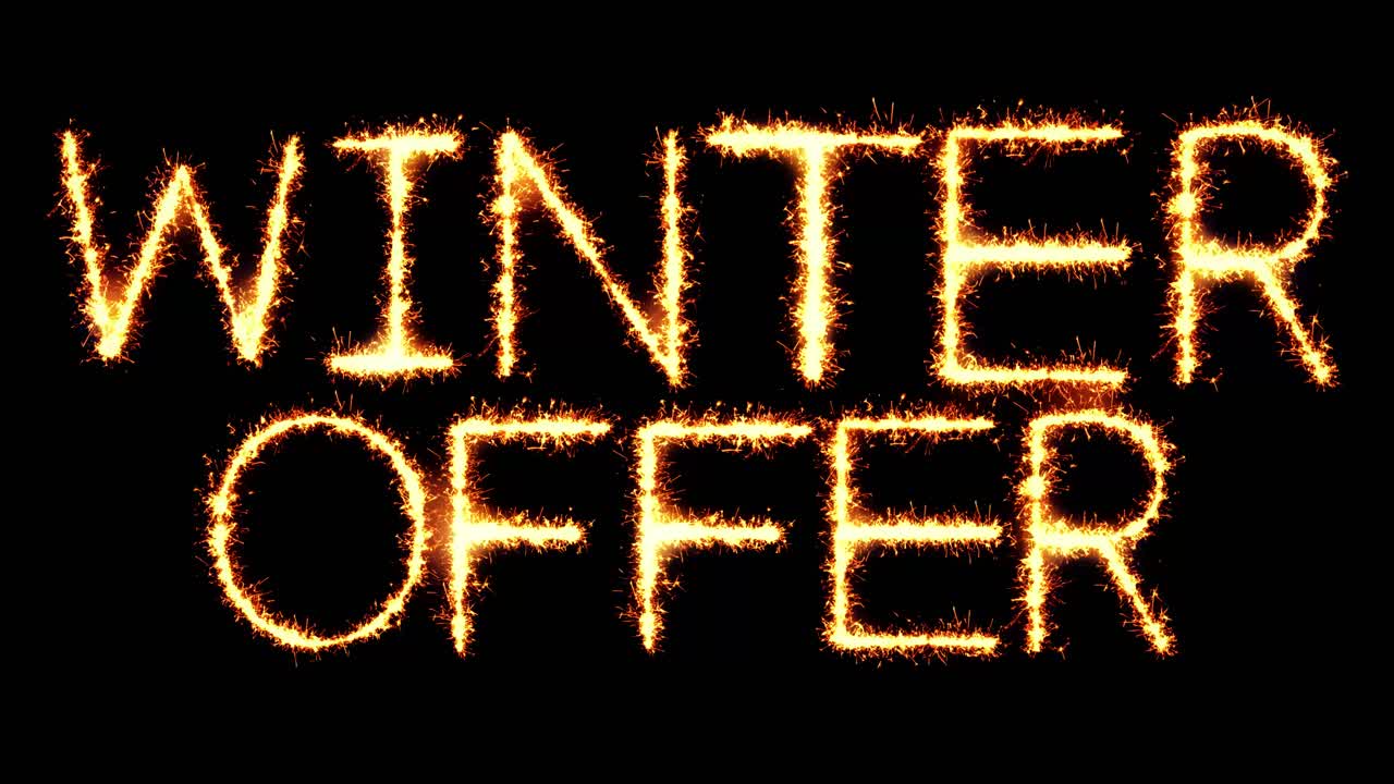 Winter offer text sparkler writing with glitter sparks particles firework on black 4k loop