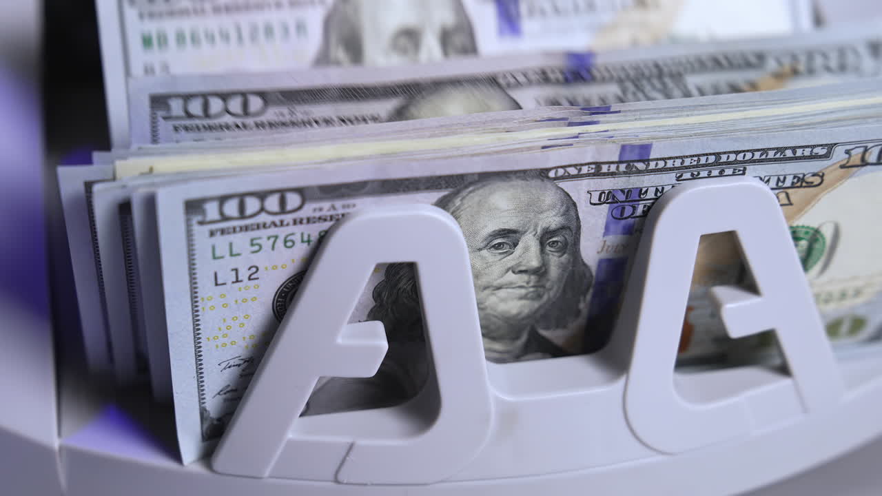 Counting machine for USD dollar paper banknote. Automatic mechanism for bank financial operations.