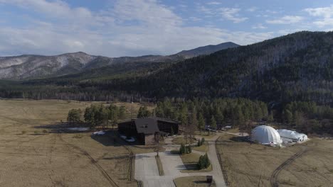 aerial view of a cabin in the mountains