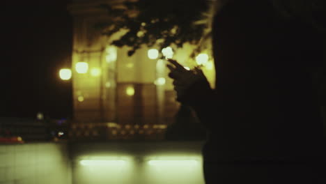 Woman-hands-together-city-moving-at-late-night-in-downtown-city.