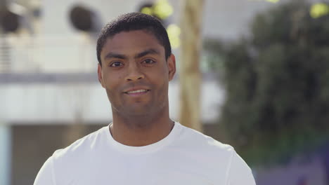 Focused-African-American-young-man-holding-smartphone.