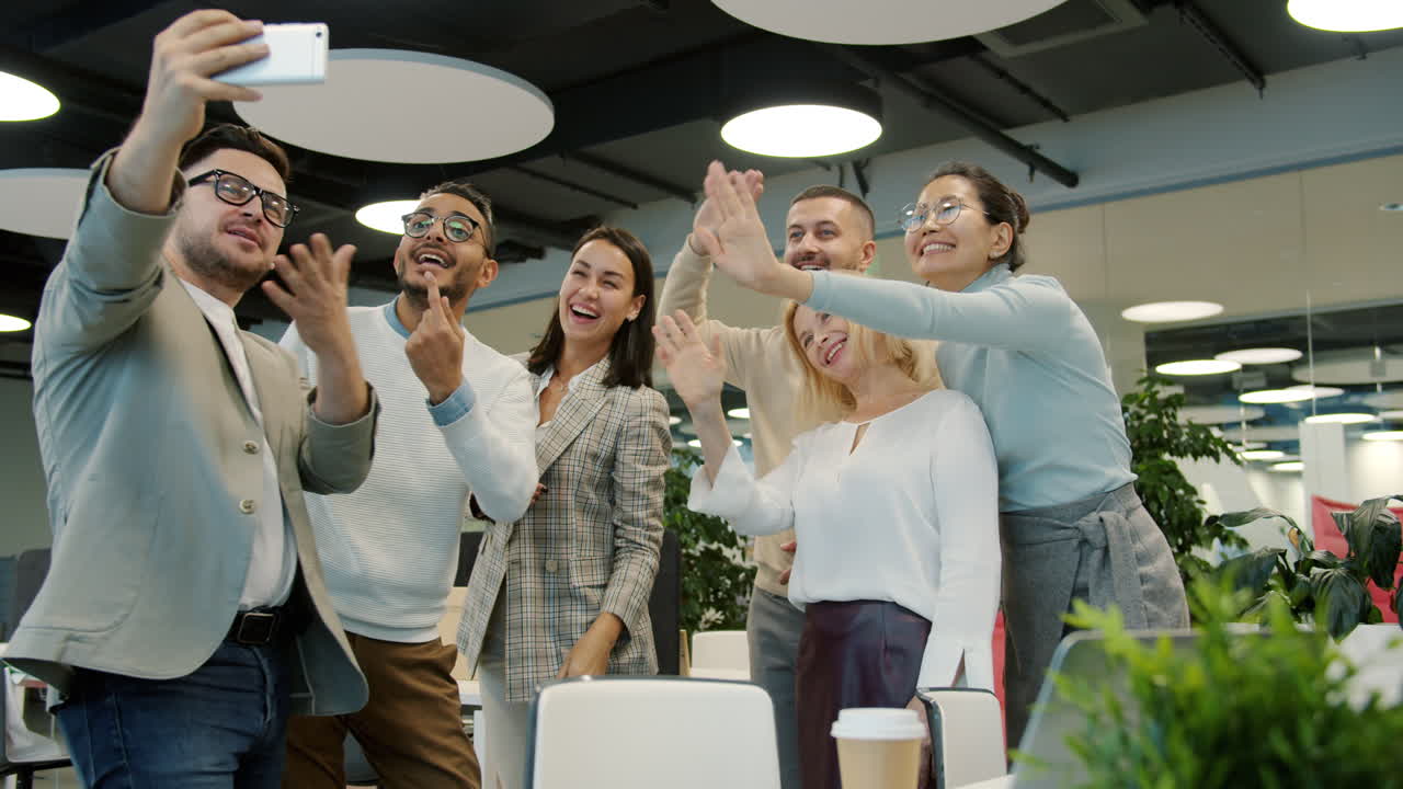 Happy Team Taking a Selfie in Modern Office