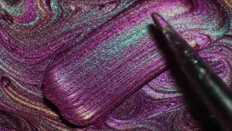 close-up of purple iridescent glitter nail polish