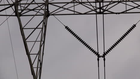 Pan-across-electrical-insulators-and-tower-structure-on-electrical-transmission-pylon