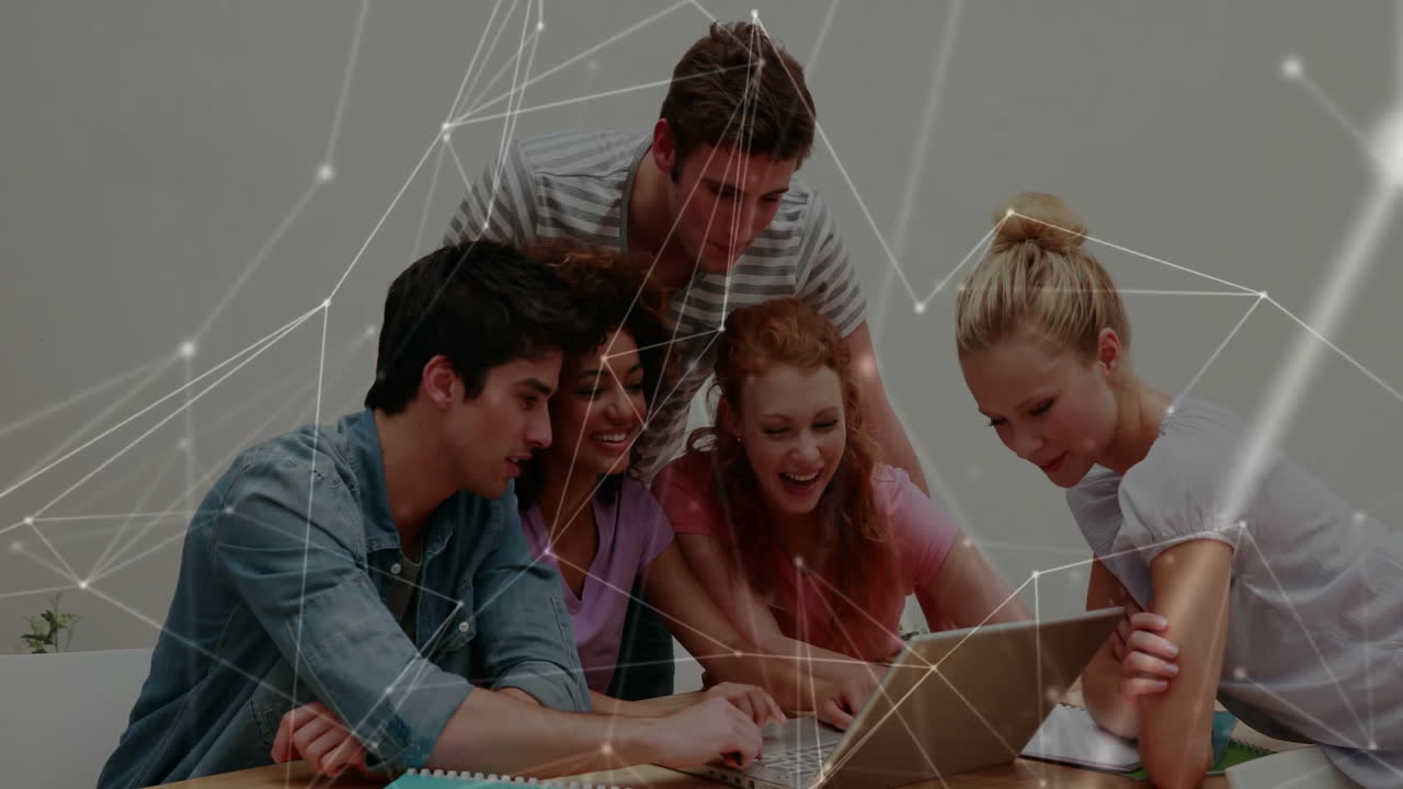 Diverse group collaborating on laptop with network connections animation overlay