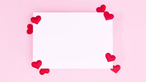 white paper for text for valentine's day decorated with hearts. stop motion