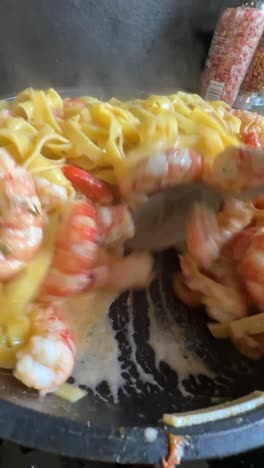 cooking creamy lobster and shrimp pasta