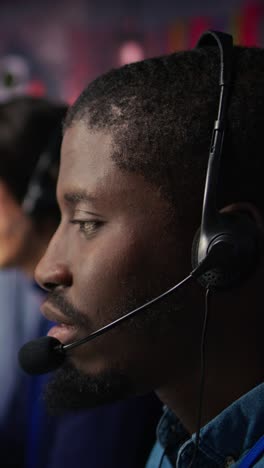 vertical video call center agent providing support, speaking in audio headset mic