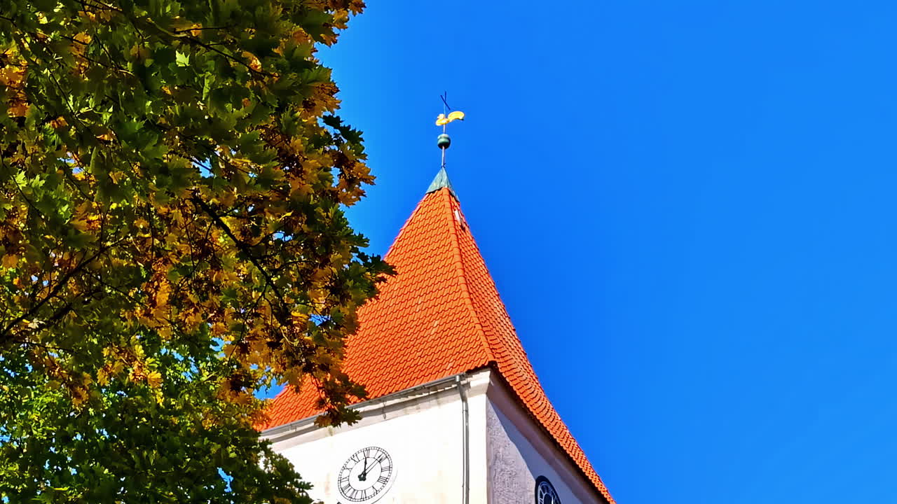 Lutheran Church Talsi tower Latvia white-stone, clear blue sky background