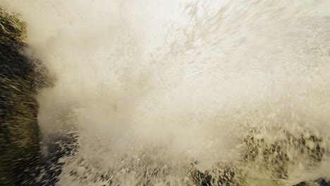 waves crashing against rocky coastline