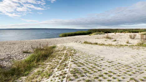 Offshore-Sand-Dune-With-Peaceful-Ocean-In-Sunny-Morning