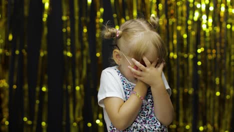 Scared-upset-child-covering-face-and-eyes-with-hands,-hiding-from-fear.-Blonde-girl-4-5-years-old