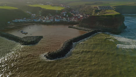 high establishing drone shot of staithes coastal village north yorkshire