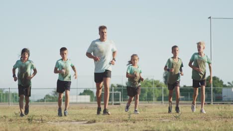 group of caucasian children training at boot camp