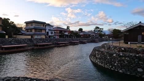 Riverside-cityscape-of-Uji,-Kyoto,-Japan