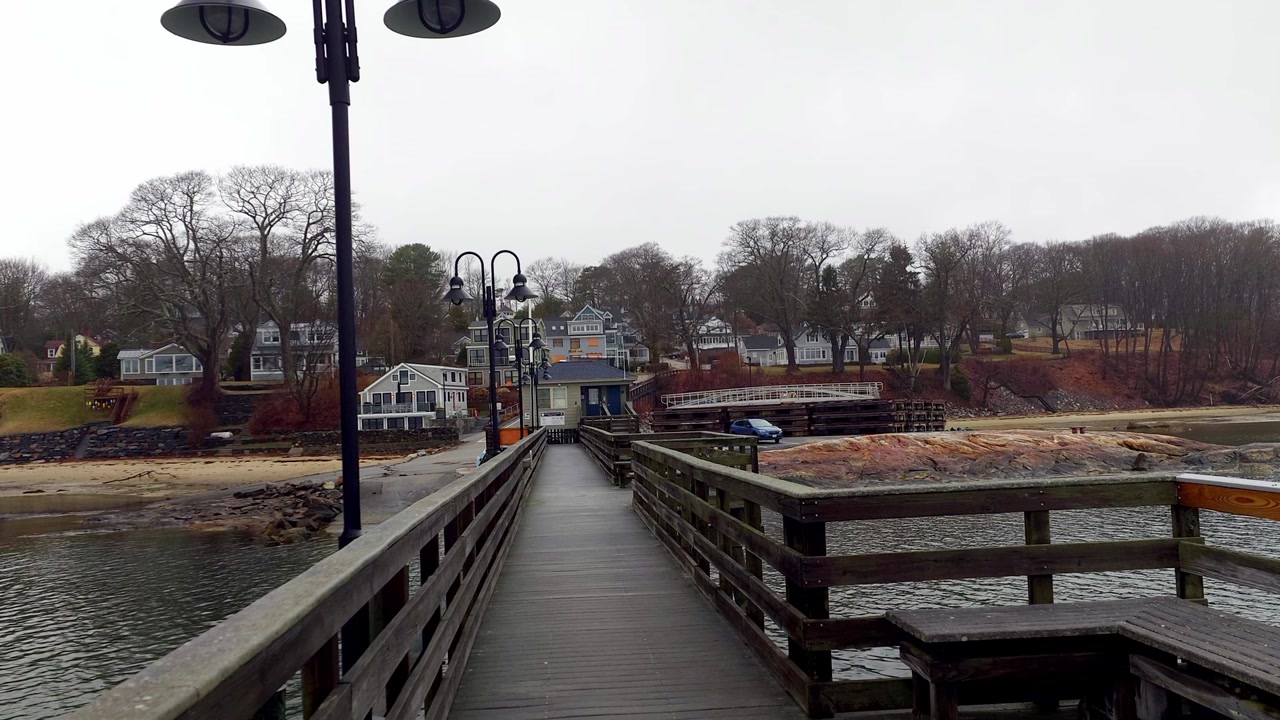 Long pier leading to shore Town Landing Harbor Falmouth, Maine