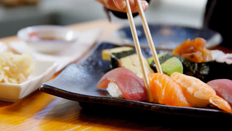 woman having sushi in restaurant 4k