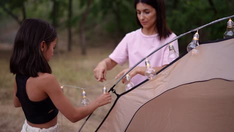 mother and daughter camping together