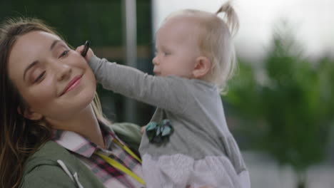 close up business woman mother with baby daughter at work playful toddler enjoying loving mom successful motherhood in office workplace