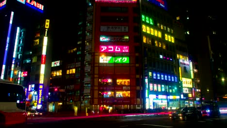 night lapse with many japanese neons at shinjuku south side tilt down