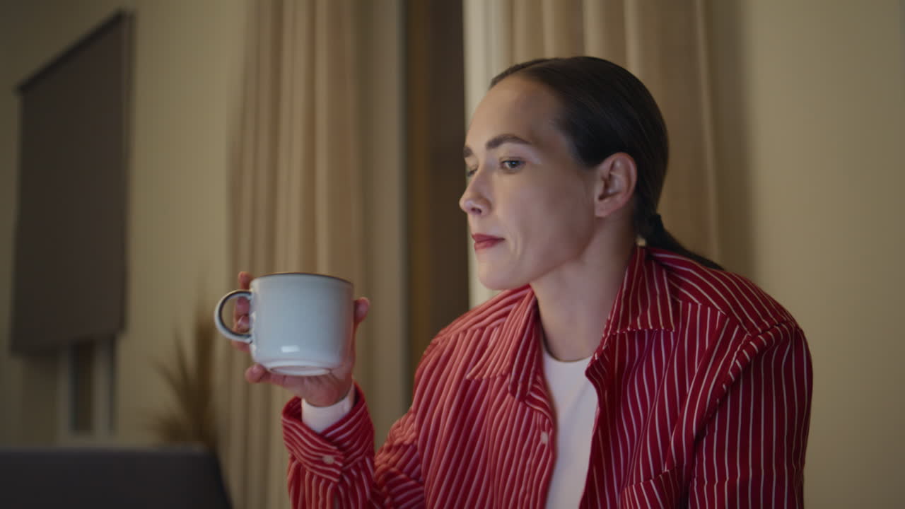 Focused professional sip coffee while working on laptop closeup. Tired woman