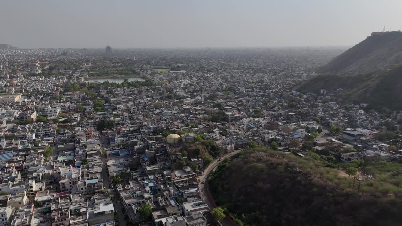High-altitude view of a historic fort dominating the Jaipur skyline.