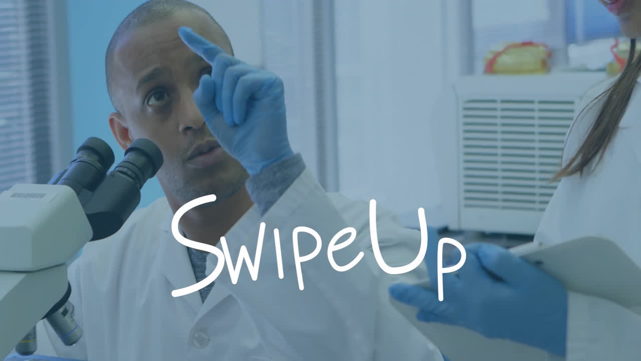 In school lab, scientist gesturing near microscope with animation overlay