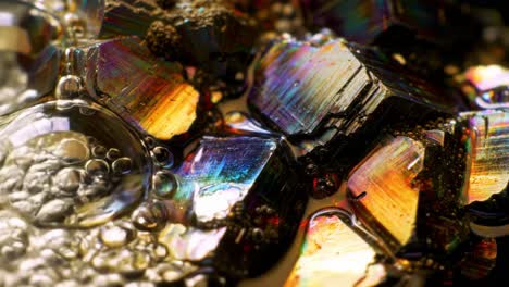 a captivating close-up of iridescent crystals reflecting a spectrum of colors on a textured surface, showcasing their unique patterns and beauty