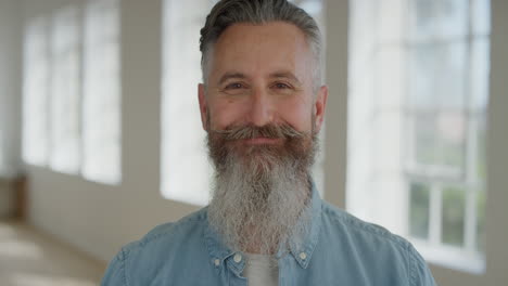 portrait-of-mature-caucasian-man-smiling-cheerful-looking-at-camera-enjoying-successful-lifestyle-happy-senior-male-with-stylish-beard