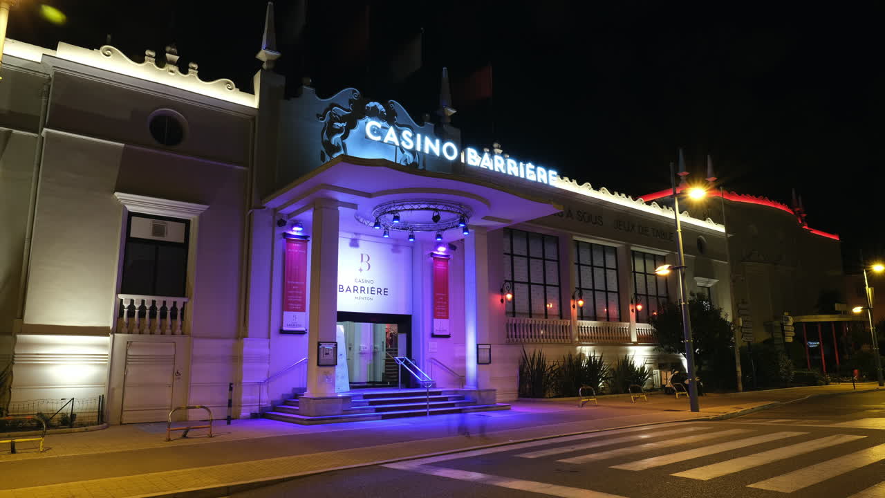 Casino Barrière in Menton by night, in Cote d'Azur, France. Timelapse