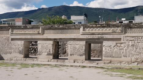 slow motion landscape of temple wall monument at mitla ruins palace archaeology museum zone in oaxaca city mexico central america town village landmark tourism