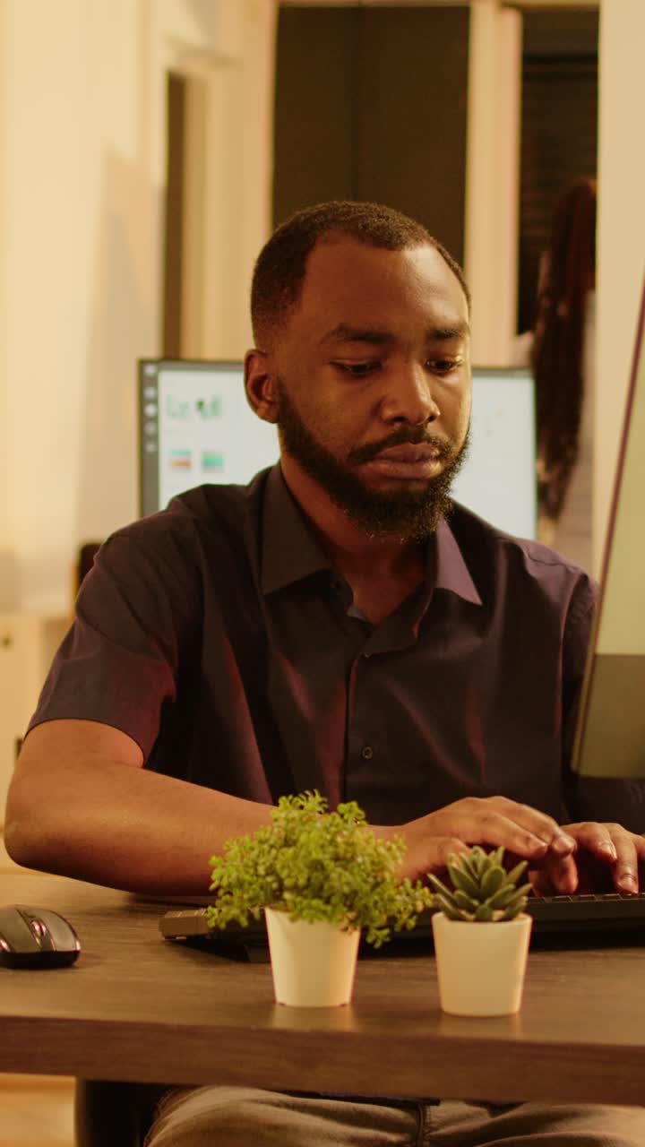 Man working on computer at desk