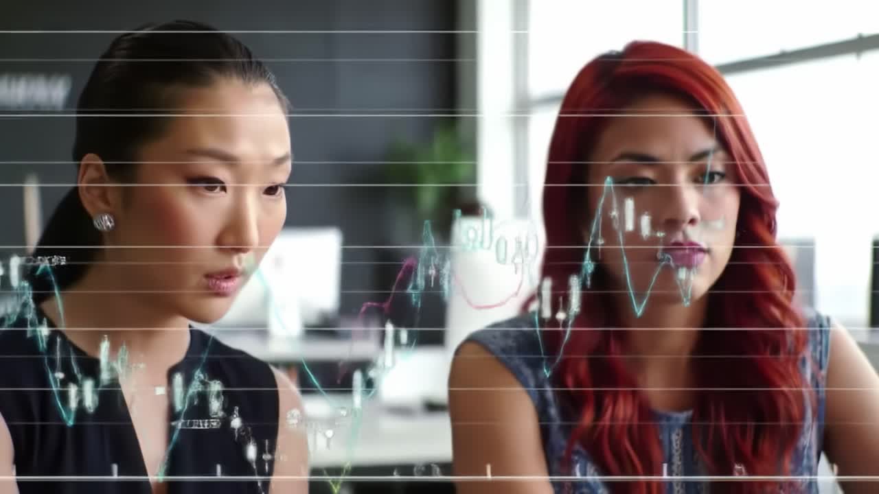 Two women engage in a conversation about financial data while sitting at a contemporary office. Digital graphs illustrate key trends and insights in the background.
