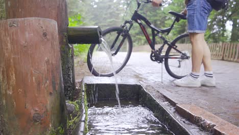 drinking water from the spring in nature.