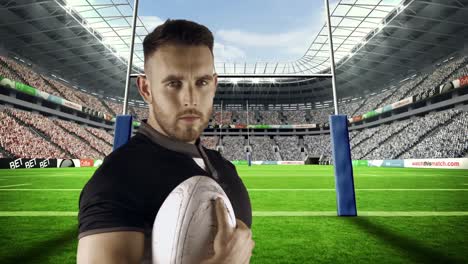 serious rugby player holds rugby ball