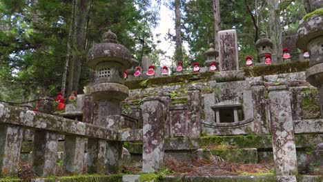 slow motion slider over temple grounds at mt. koya with jizo statue