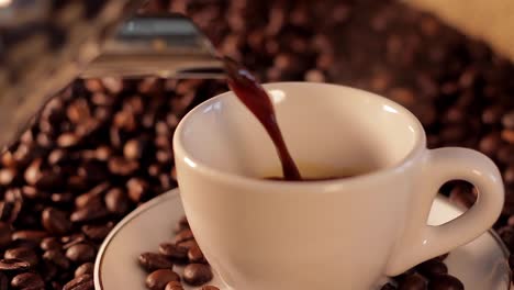 pouring hot steaming coffee in a cup