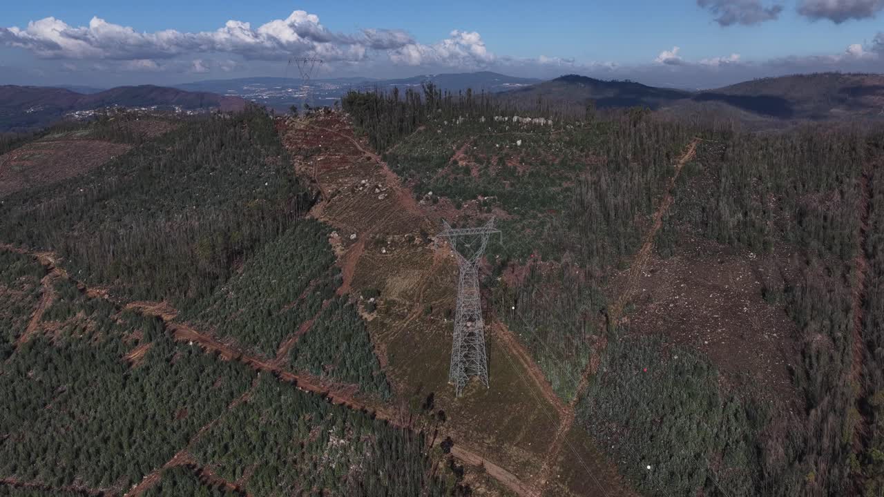 Talll transmission towers over a mountain
