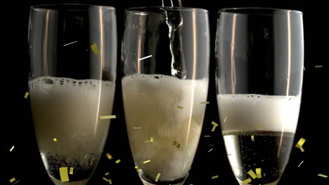 animation of confetti falling over champagne glasses on black background