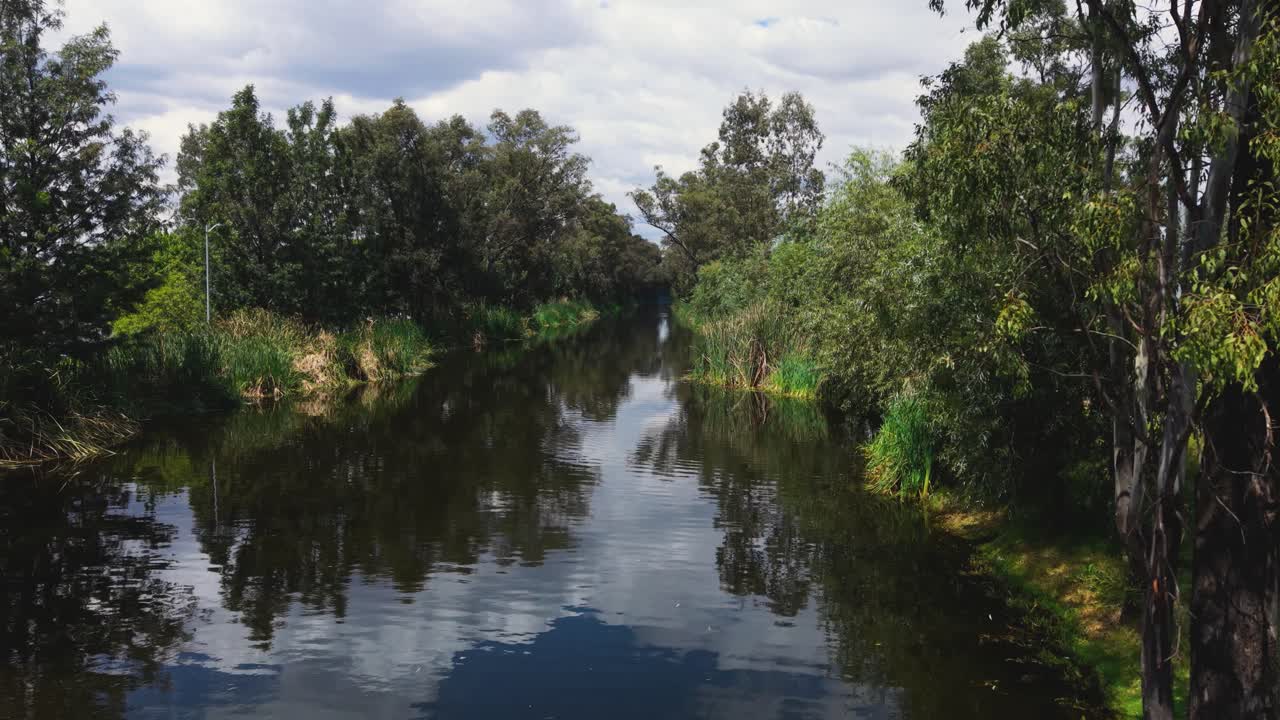 Xochimilco canals in southern Mexico City, with a low drone shot