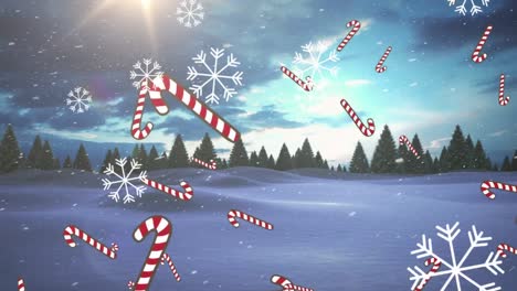 Multiple-candy-cane-icons-and-snowflakes-falling-over-winter-landscape-against-blue-sky