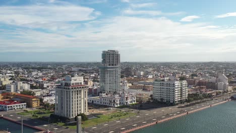 aerial panoramic of the coastal city of veracruz, mexico, displays a harmonious blend of modern high-rises and historic architecture along the seaside