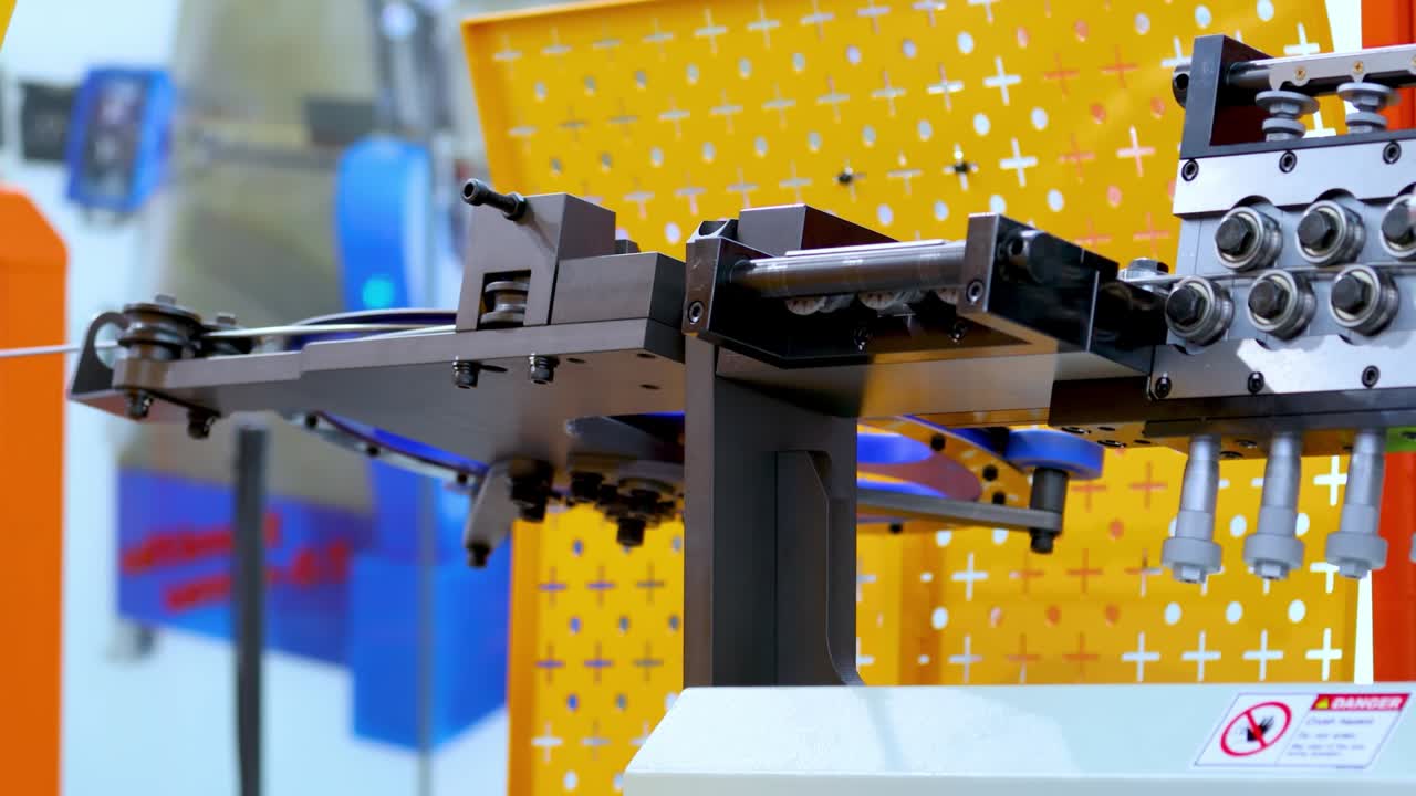 Wire bending machine. CNC metal processing. Automated metalworking machine.