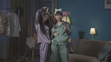 two friends taking a selfie in pajamas