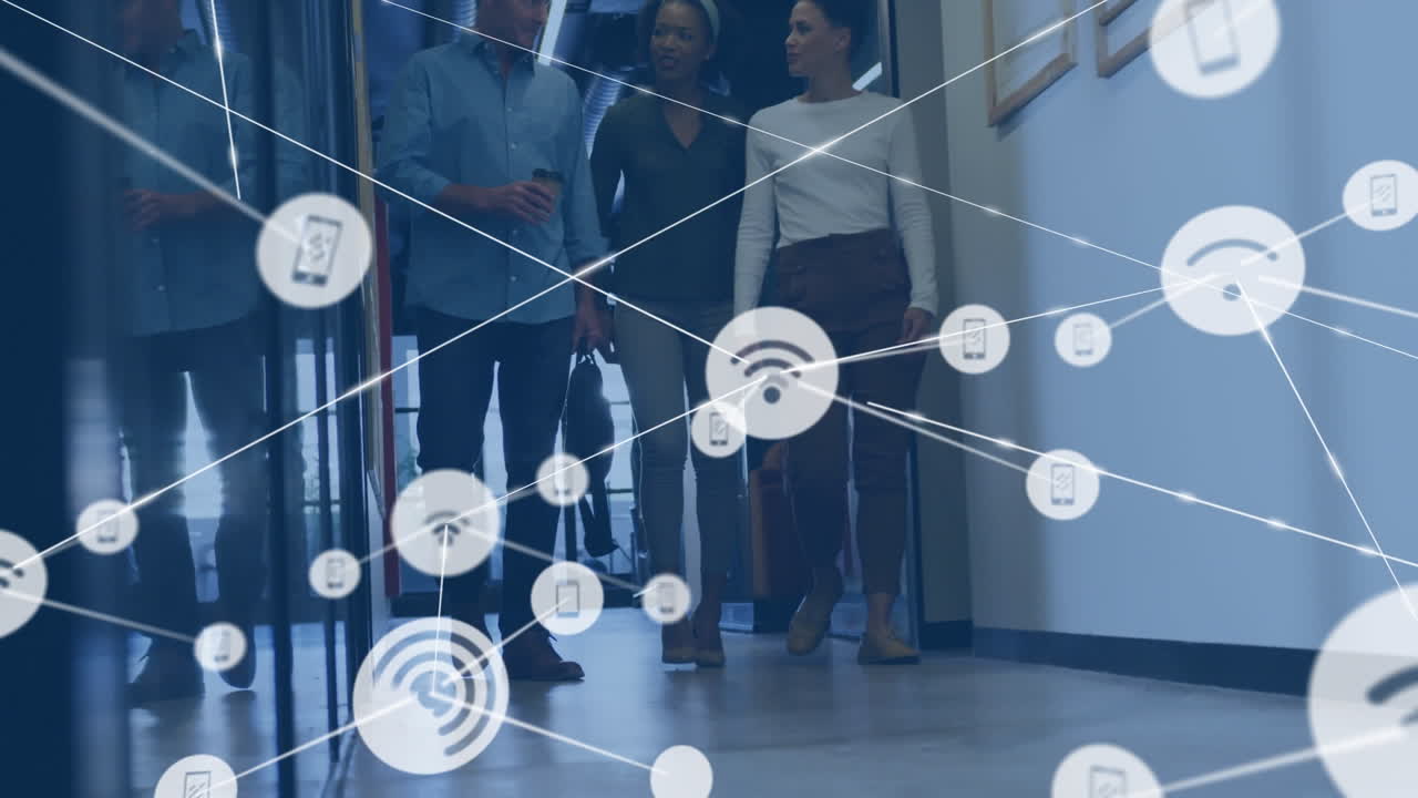 Animation of network of digital icons over diverse team of colleagues discussing together at office