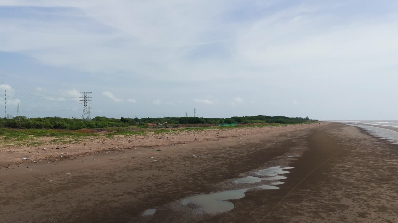Aerial View Dolly of Beach in Ben Tre with Horn Snails.