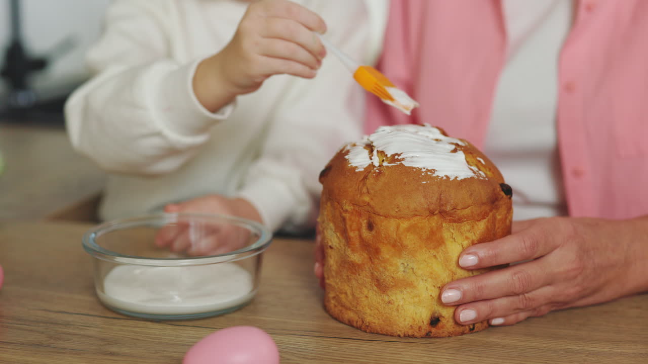 Grandparent and Child Decorating Easter Bread